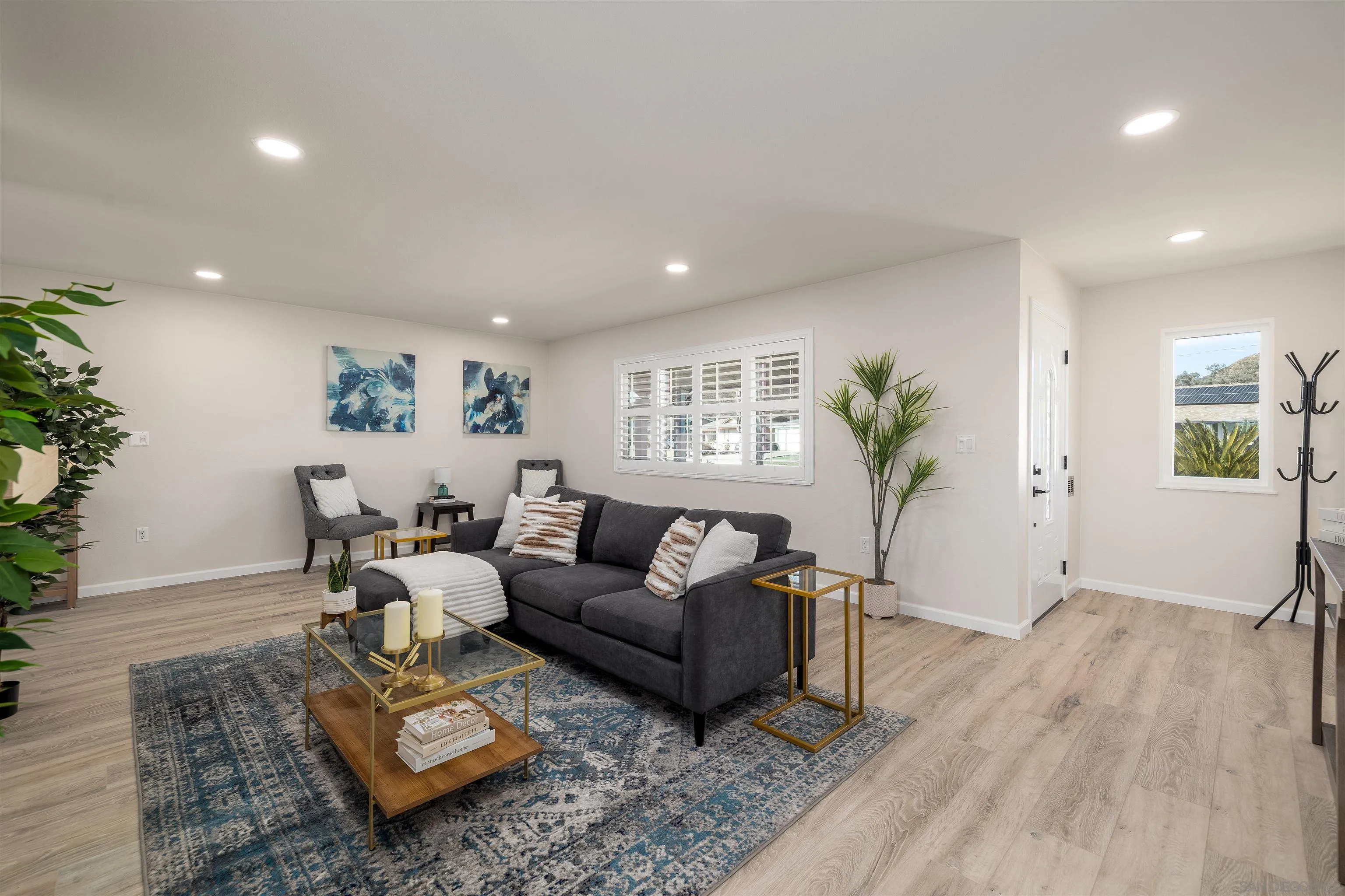 27431 El Rancho Road Menifee, CA 92586 - Photo 9 of 39 a living room with furniture and a wooden floor