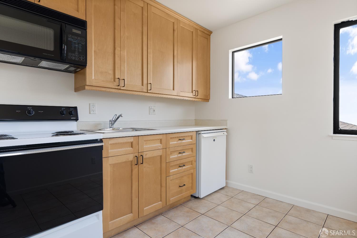 855 Bates Avenue El Cerrito, CA 94530 - Photo 39 of 48 a kitchen with stainless steel appliances granite countertop a refrigerator and a stove top oven