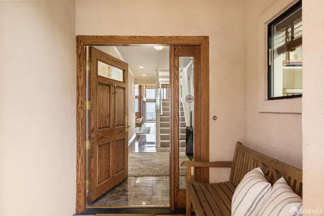 a view of a livingroom with furniture and windows
