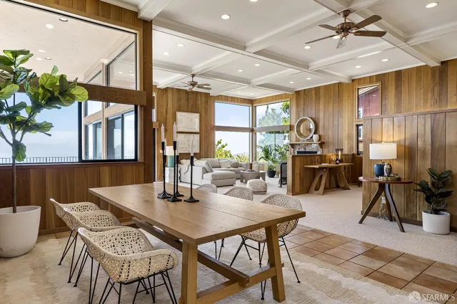a view of a dining room with furniture window and outside view