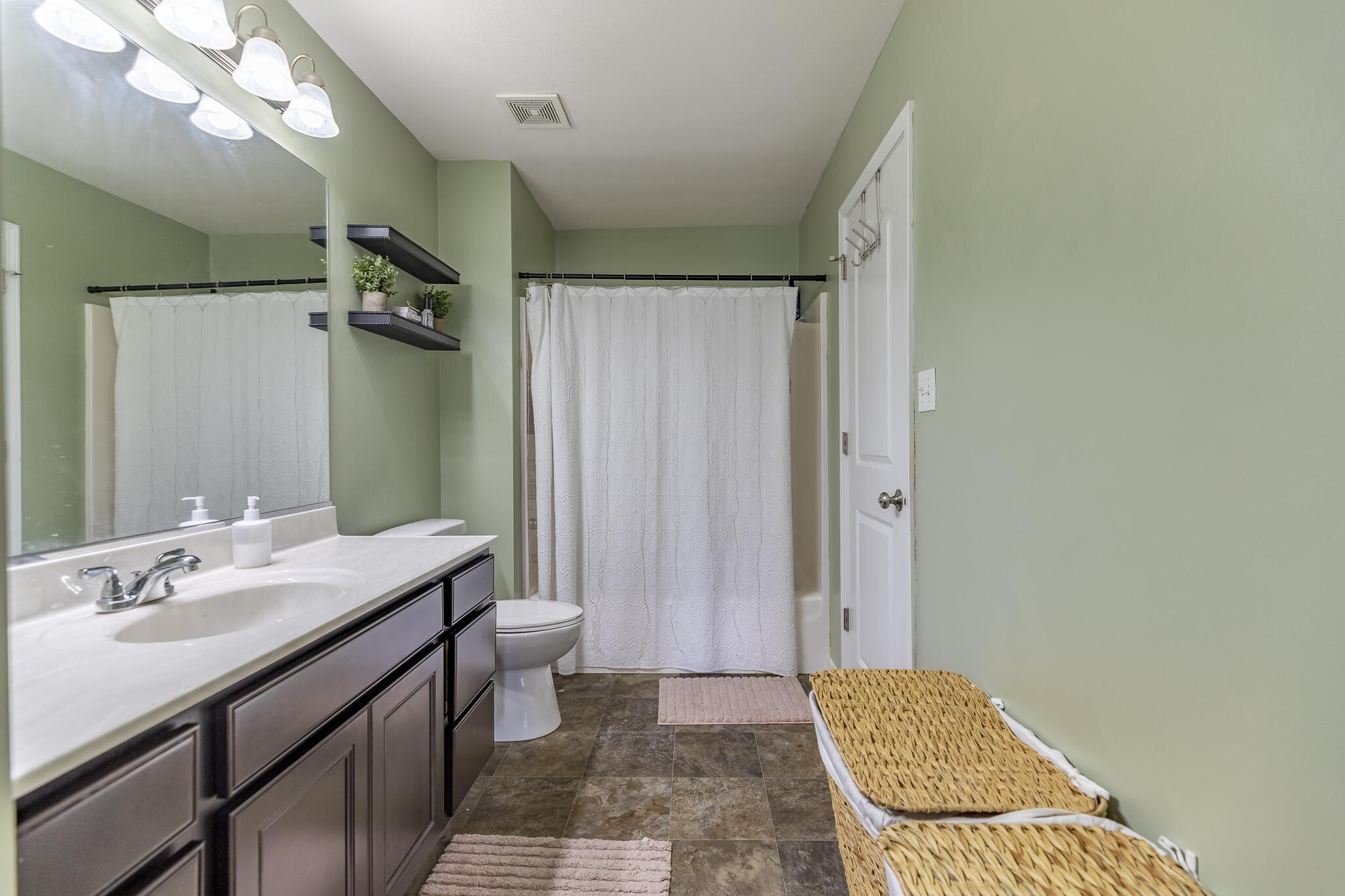 11527 Rhode Island Street Crown Point, IN 46307 - Photo 12 of 17 a bathroom with a sink a toilet a mirror and shower