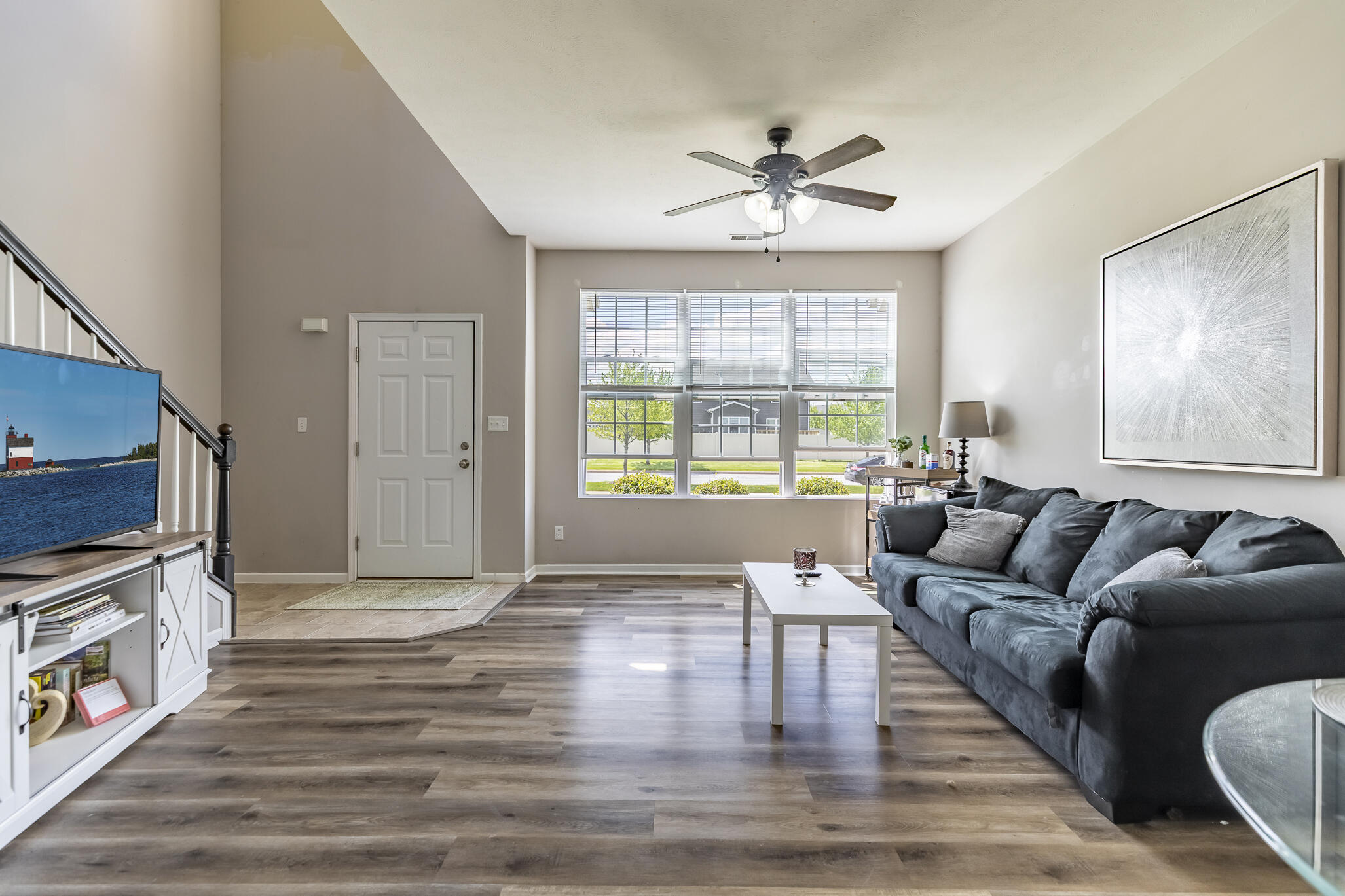 11527 Rhode Island Street Crown Point, IN 46307 - Photo 5 of 17 a living room with furniture and a flat screen tv