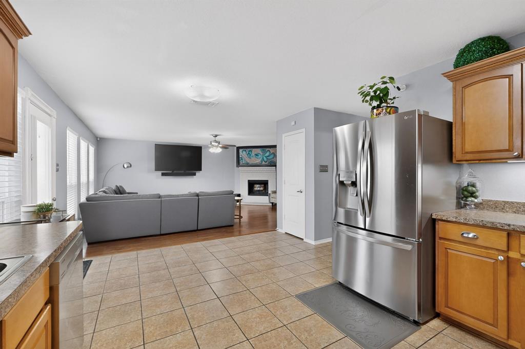 3825 Clay Mathis Road Mesquite, TX 75181 - Photo 13 of 39 a kitchen with stainless steel appliances a refrigerator and a stove top oven