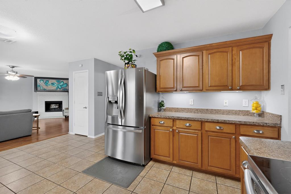 3825 Clay Mathis Road Mesquite, TX 75181 - Photo 15 of 39 a kitchen with stainless steel appliances granite countertop a refrigerator sink and cabinets