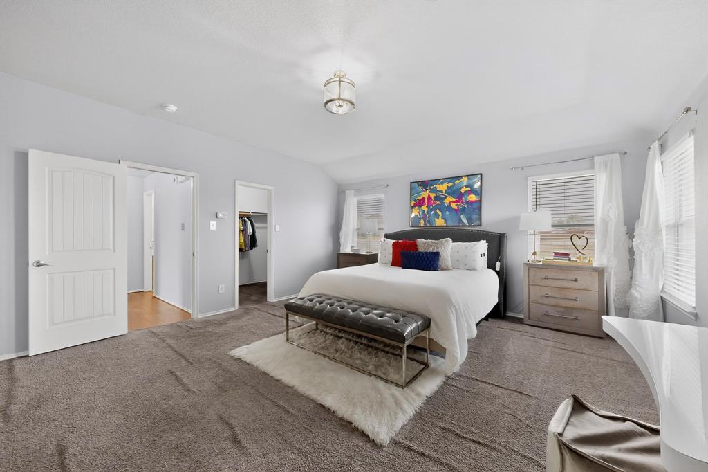 3825 Clay Mathis Road Mesquite, TX 75181 - Photo 17 of 39 a spacious bedroom with a bed and a cabinets