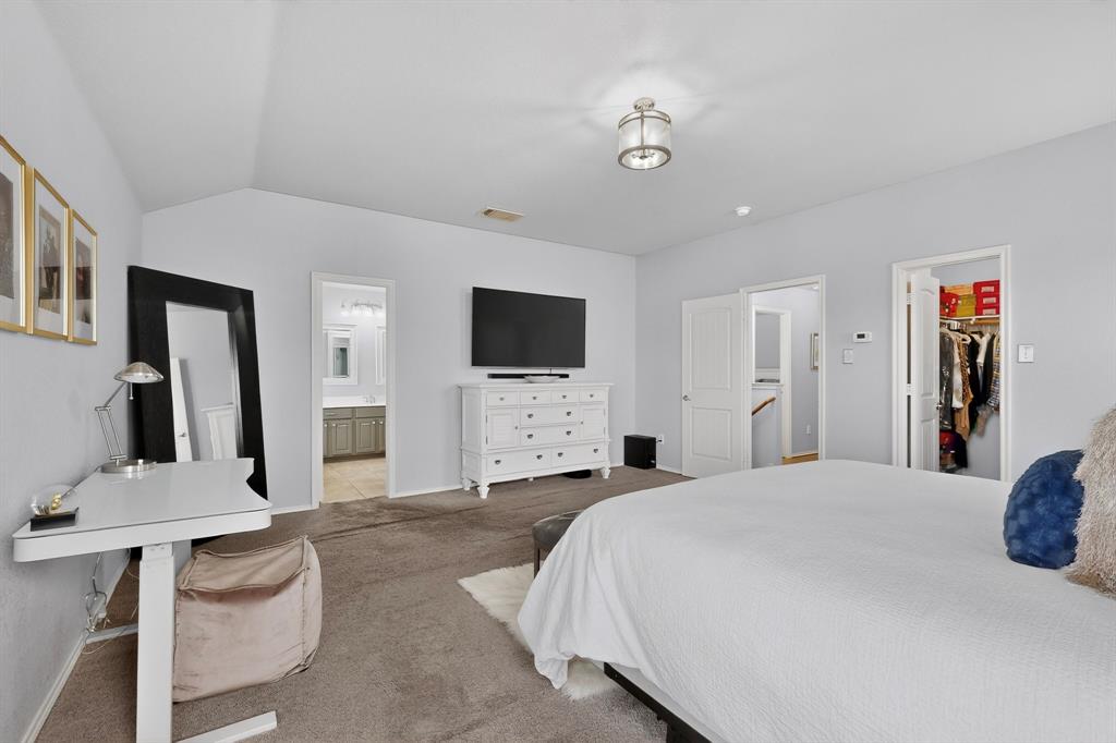 3825 Clay Mathis Road Mesquite, TX 75181 - Photo 18 of 39 a spacious bedroom with a bed and a flat screen tv