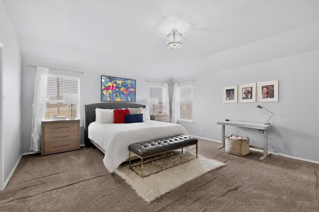 3825 Clay Mathis Road Mesquite, TX 75181 - Photo 19 of 39 a bedroom with a bed and a cabinets