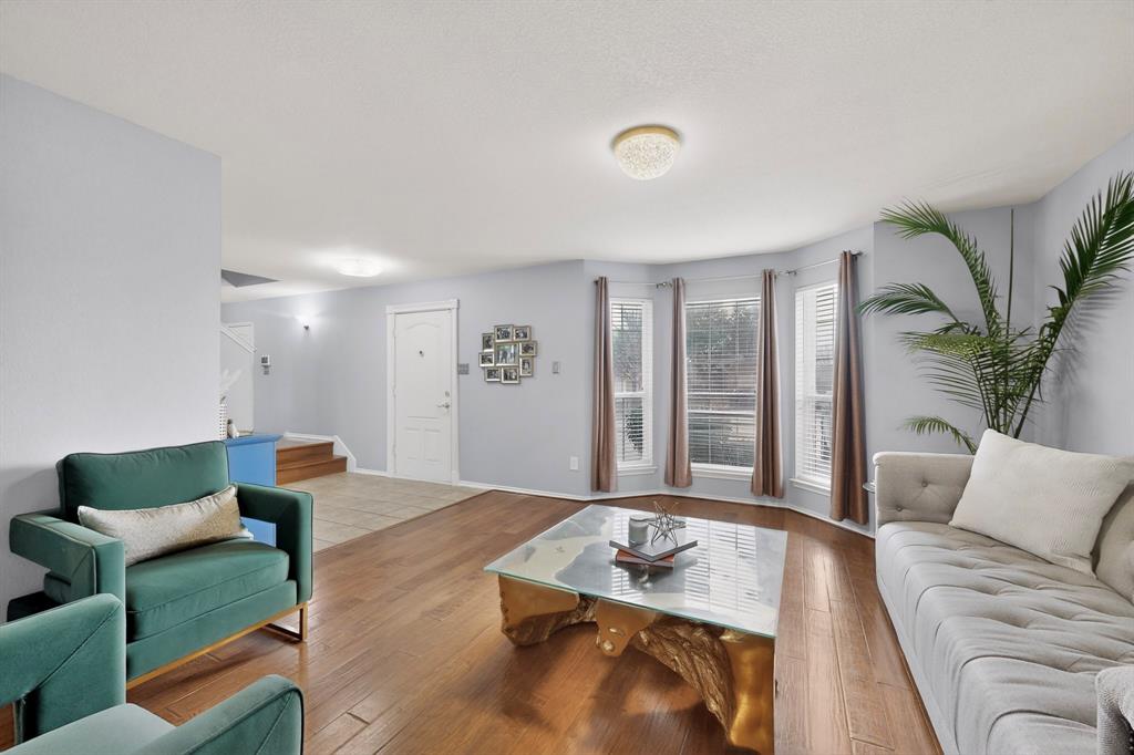 3825 Clay Mathis Road Mesquite, TX 75181 - Photo 2 of 39 a living room with furniture and a large window