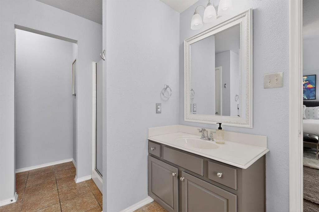 3825 Clay Mathis Road Mesquite, TX 75181 - Photo 21 of 39 a bathroom with a sink and a mirror