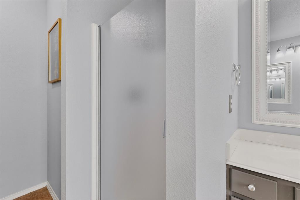 3825 Clay Mathis Road Mesquite, TX 75181 - Photo 22 of 39 a bathroom with a bathtub and a shower