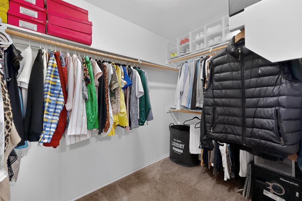 3825 Clay Mathis Road Mesquite, TX 75181 - Photo 23 of 39 a view of walk in closet with clothes and shoes