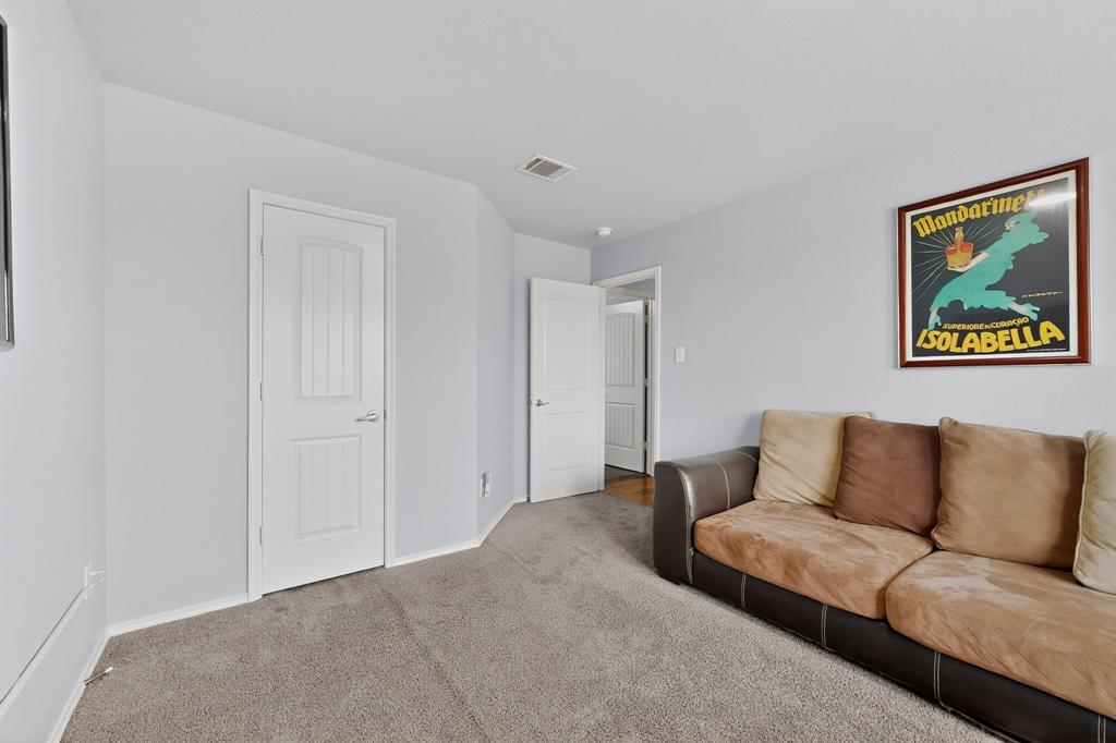 3825 Clay Mathis Road Mesquite, TX 75181 - Photo 30 of 39 a living room with furniture and a rug