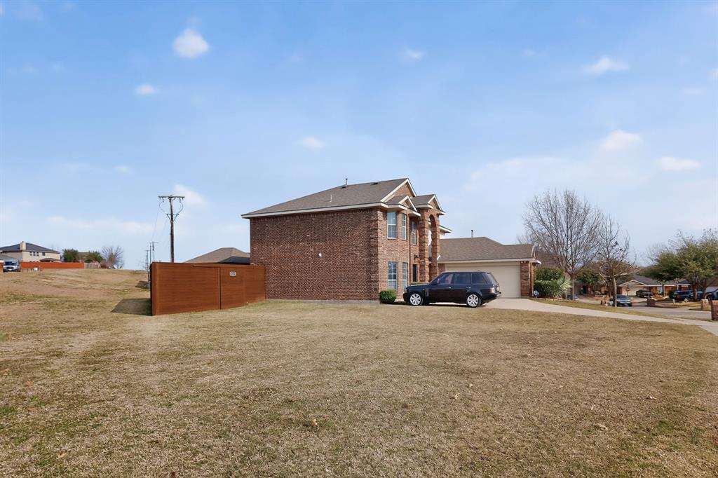3825 Clay Mathis Road Mesquite, TX 75181 - Photo 39 of 39 a view of a house with a yard and garage
