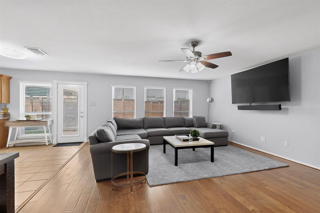 3825 Clay Mathis Road Mesquite, TX 75181 - Photo 7 of 39 a living room with furniture and a flat screen tv