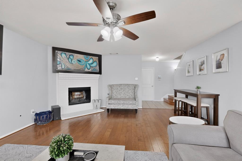 3825 Clay Mathis Road Mesquite, TX 75181 - Photo 8 of 39 a living room with furniture and a fireplace