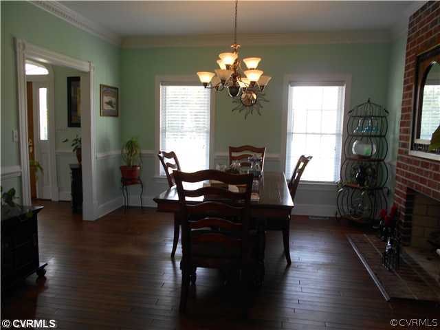5001 Treely Road Chester, VA 23831 - Photo 3 of 24 a view of a dining room with furniture window and wooden floor