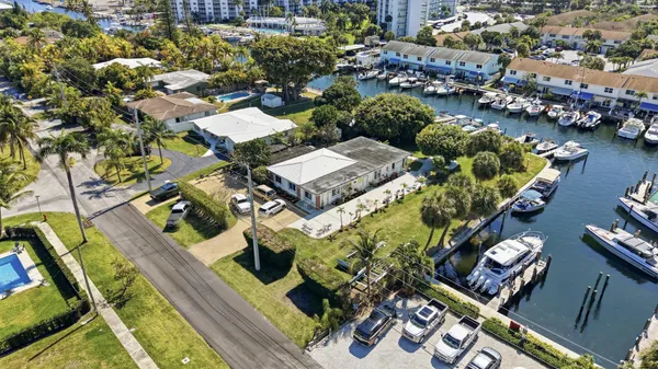 an aerial view of a houses with yard