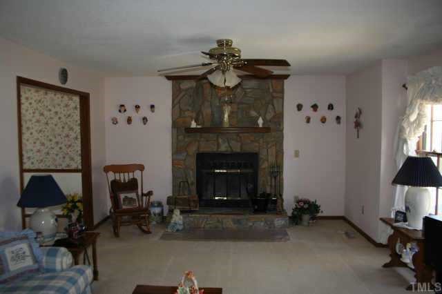 3420 Cartway Lane Raleigh, NC 27616 - Photo 4 of 7 a living room with furniture and a fireplace