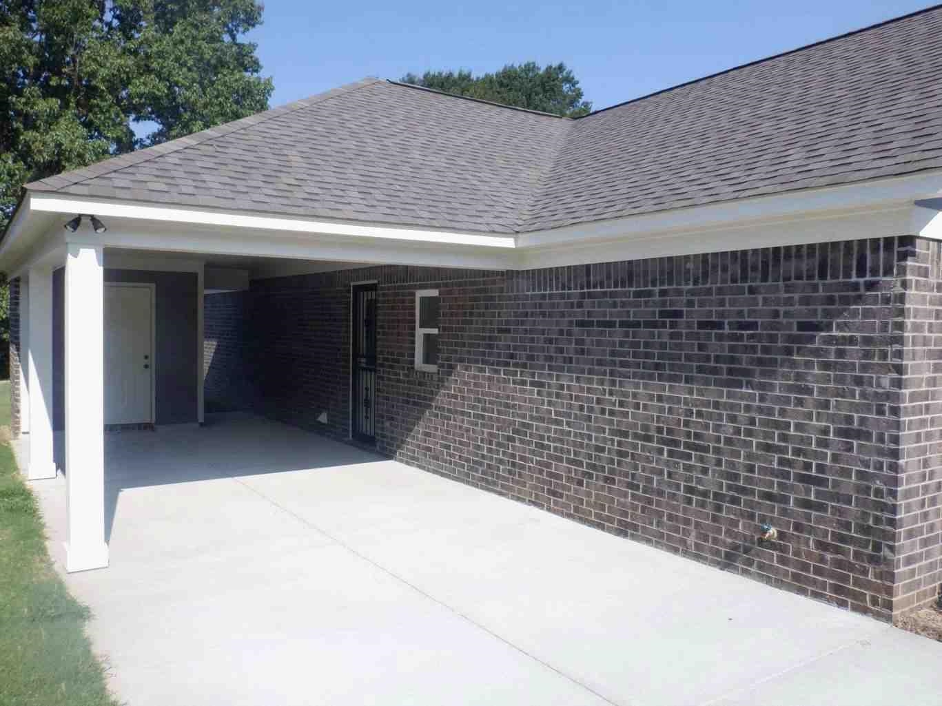 5253 Zodiac Road Memphis, TN 38118 - Photo 3 of 3 Garage with an attached carport and driveway