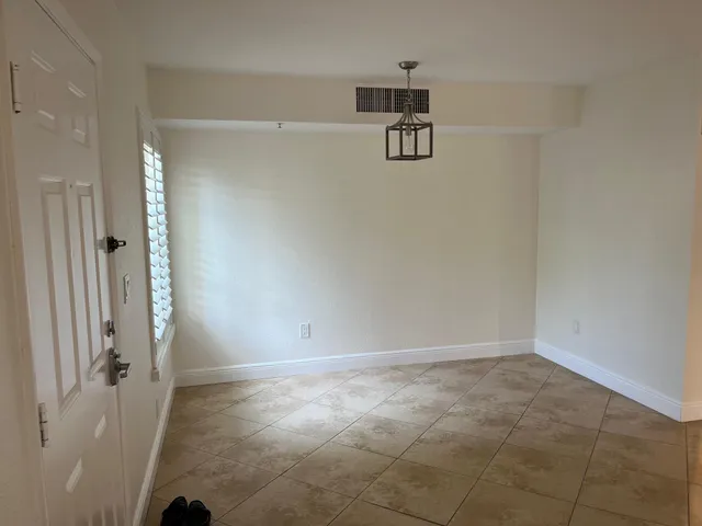 a view of a refrigerator in kitchen