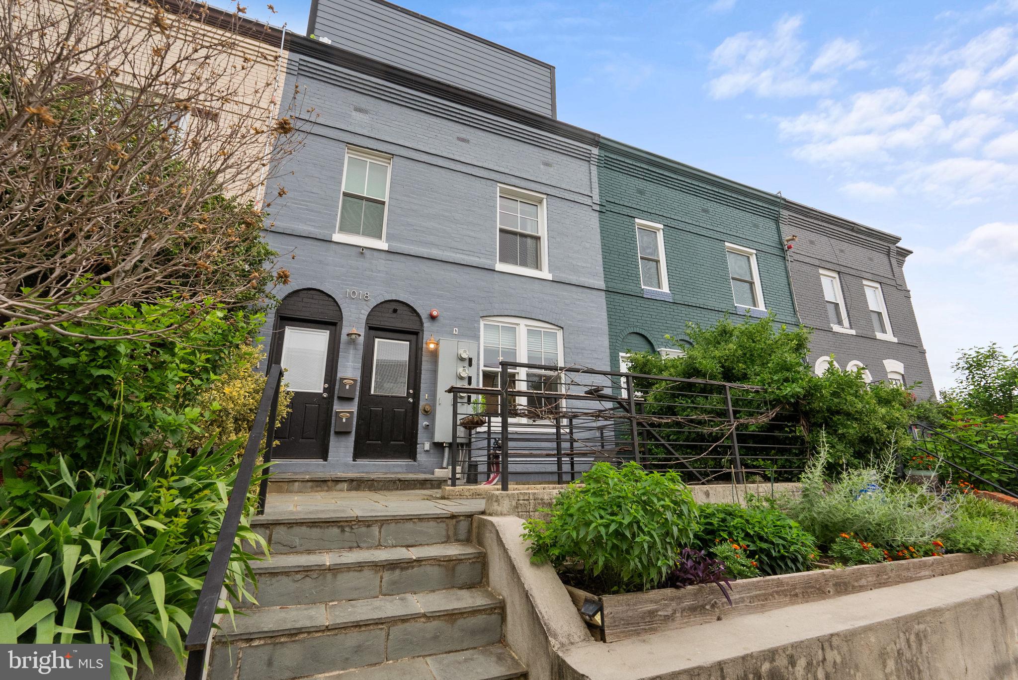 1018 13th Street Southeast, Unit 2 Washington, DC 20003 - Photo 2 of 30 a front view of a house with a garden
