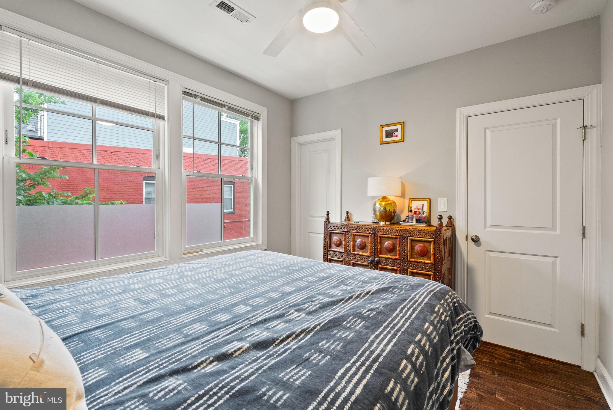 1018 13th Street Southeast, Unit 2 Washington, DC 20003 - Photo 21 of 30 a bedroom with a bed and wooden floor