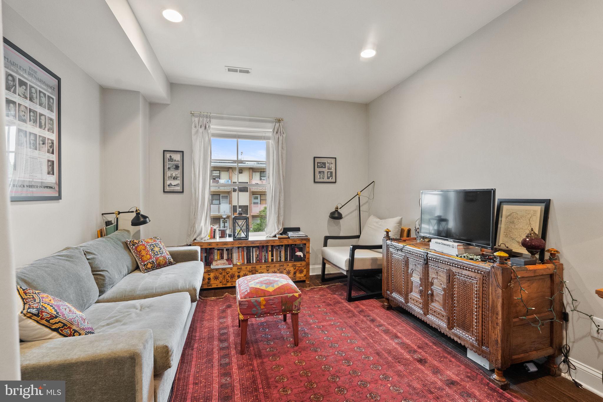 1018 13th Street Southeast, Unit 2 Washington, DC 20003 - Photo 25 of 30 a living room with furniture and a flat screen tv