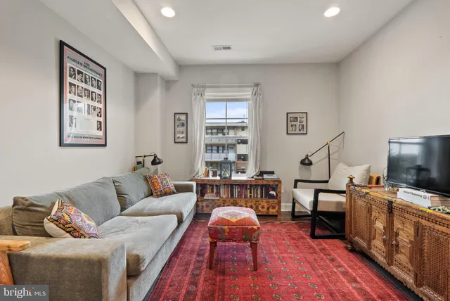 a bed room with a bed and a dresser