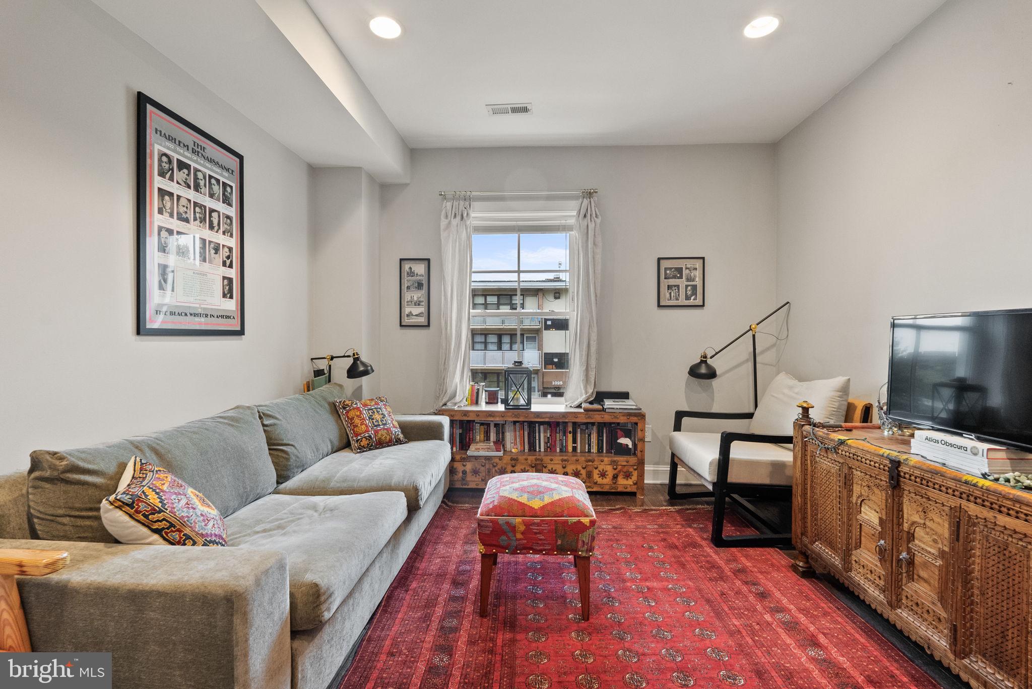 1018 13th Street Southeast, Unit 2 Washington, DC 20003 - Photo 27 of 30 a living room with furniture and a flat screen tv