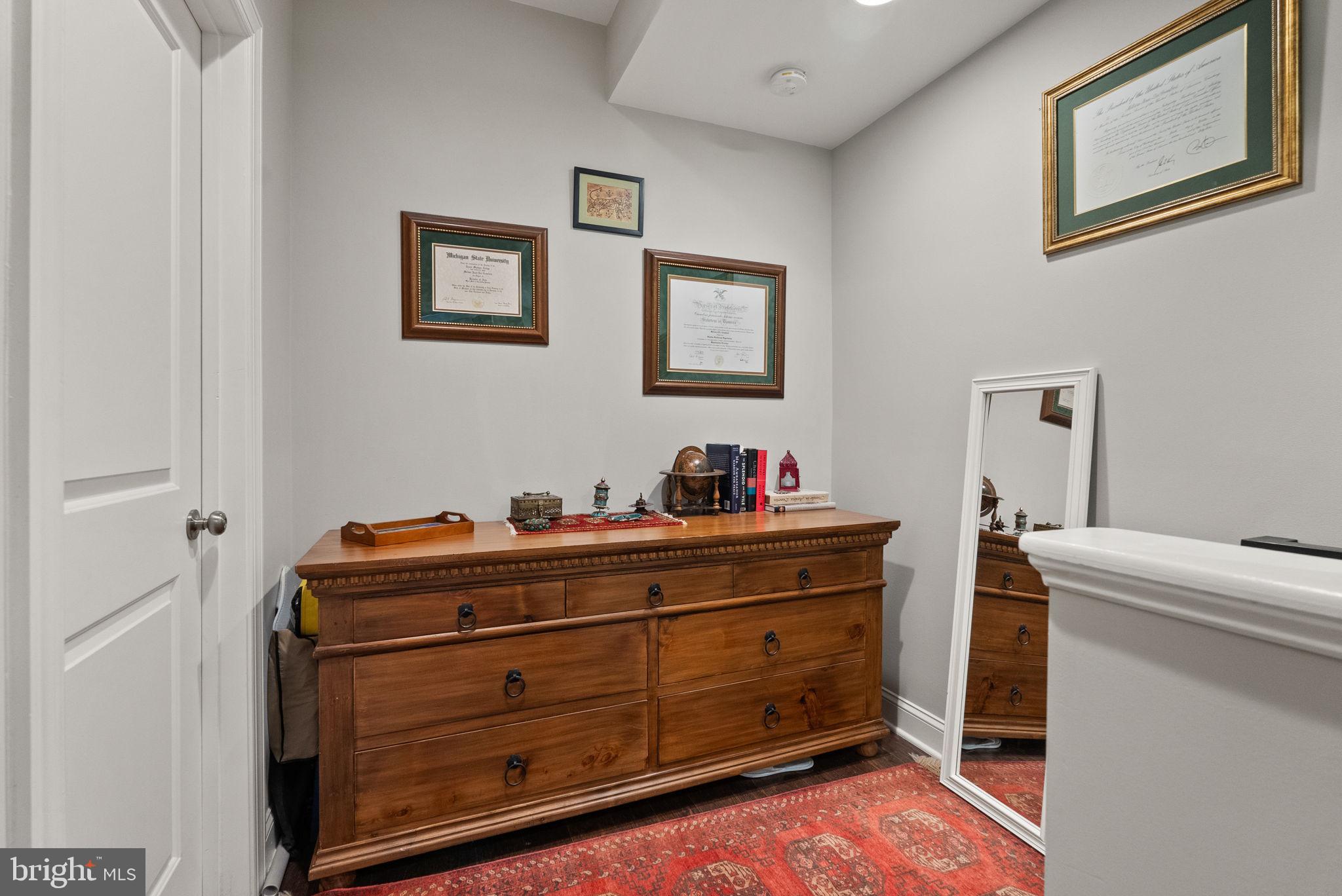 1018 13th Street Southeast, Unit 2 Washington, DC 20003 - Photo 28 of 30 a bed room with a bed and a dresser