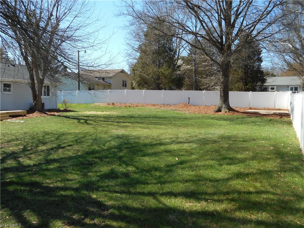 5929 Styers Ferry Road Clemmons, NC 27012 - Photo 15 of 28 In this view we get a feeling for the overall size of this backyard area. Great place for the kids to play, a pet to run and a pretty good place for some sort of a garden and maybe even a friendly game of badminton .