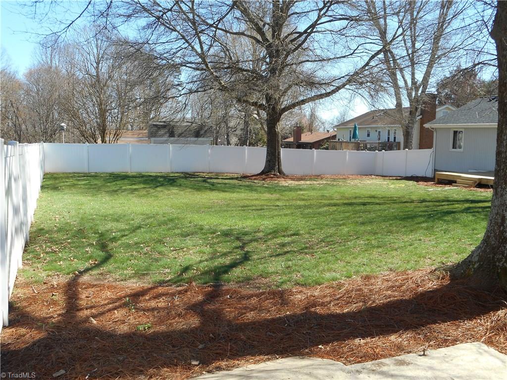 5929 Styers Ferry Road Clemmons, NC 27012 - Photo 16 of 28 In this view we can see all the open space this backyard has for the kids to play in, the family dog to run around and how about a fresh garden with vegetables / flowers .