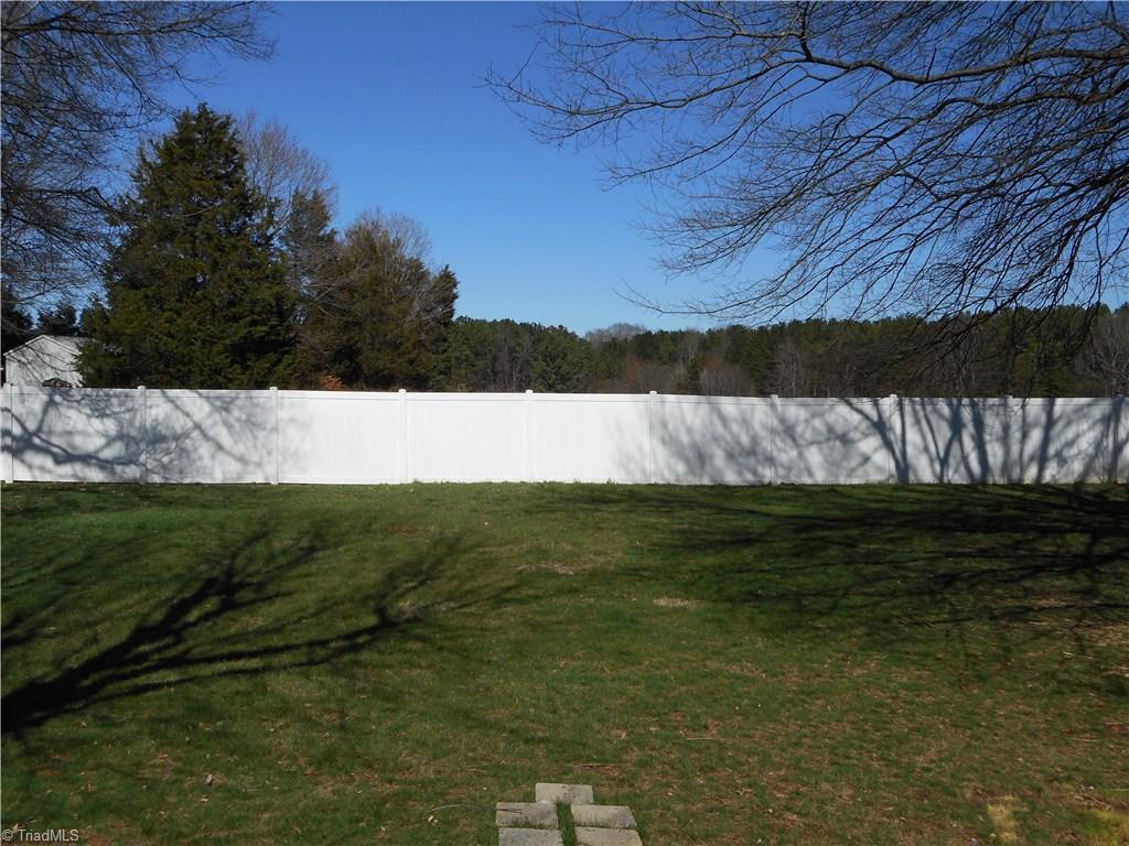 5929 Styers Ferry Road Clemmons, NC 27012 - Photo 18 of 28 In this view we are looking out over the backyard area where you can see that awesome vinyl fence that encloses the entire backyard,
