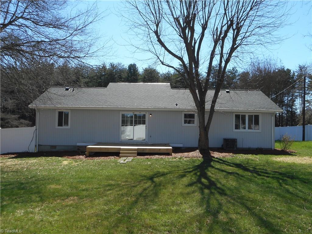 5929 Styers Ferry Road Clemmons, NC 27012 - Photo 10 of 28 In this full rear view of the home we have the rear deck area for those great family entertaining parties, maybe a BBQ or something like that. You also have the sliding door from the deck to the kitchen area.