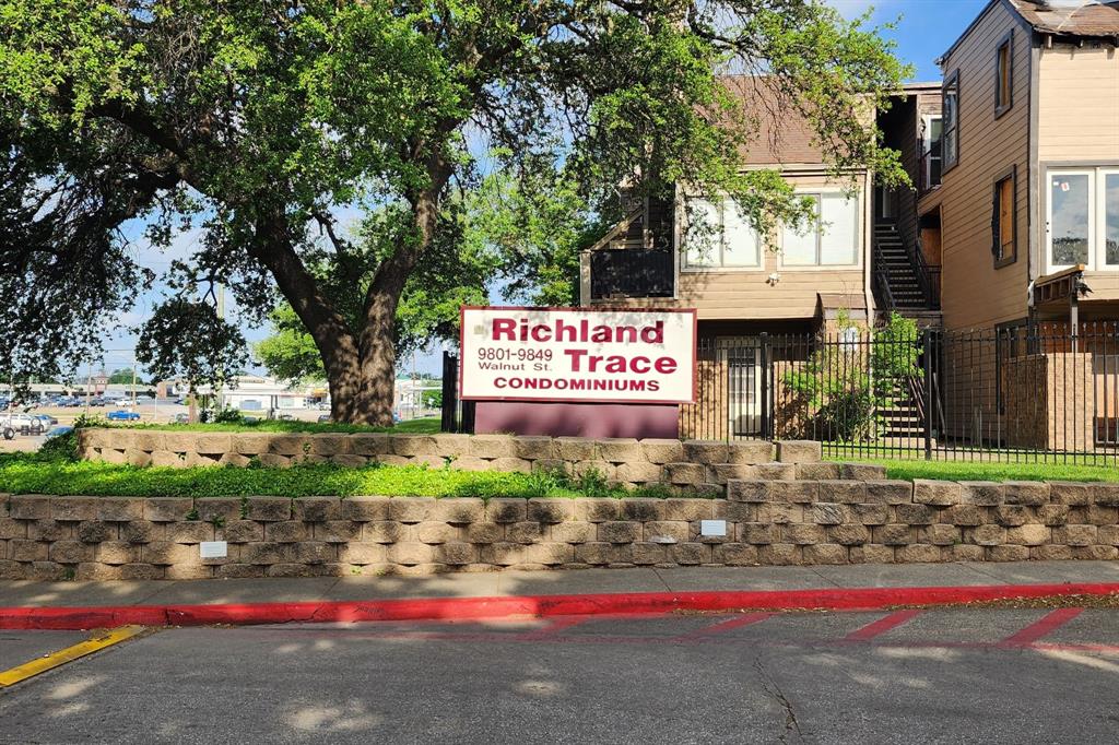 9813 Walnut Street, Unit 201 Dallas, TX 75243 - Photo 1 of 2 a sign on the side of a road