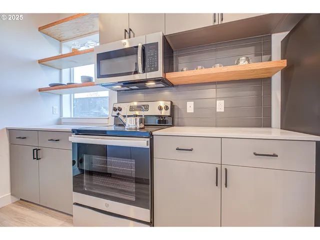 a kitchen with a cabinets and a stove