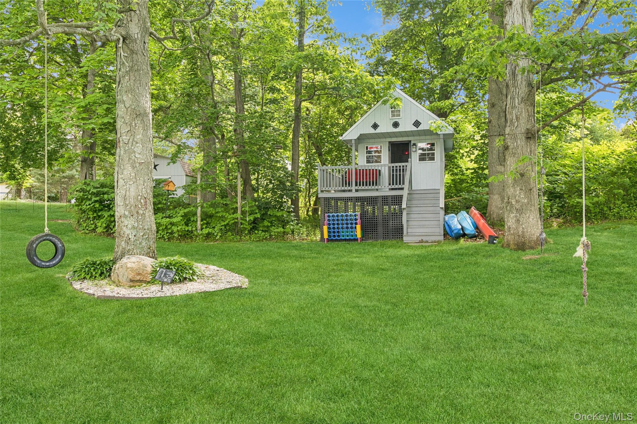 42 Adelia Path Riverhead, NY 11901 - Photo 21 of 30 Back yard featuring a tree house