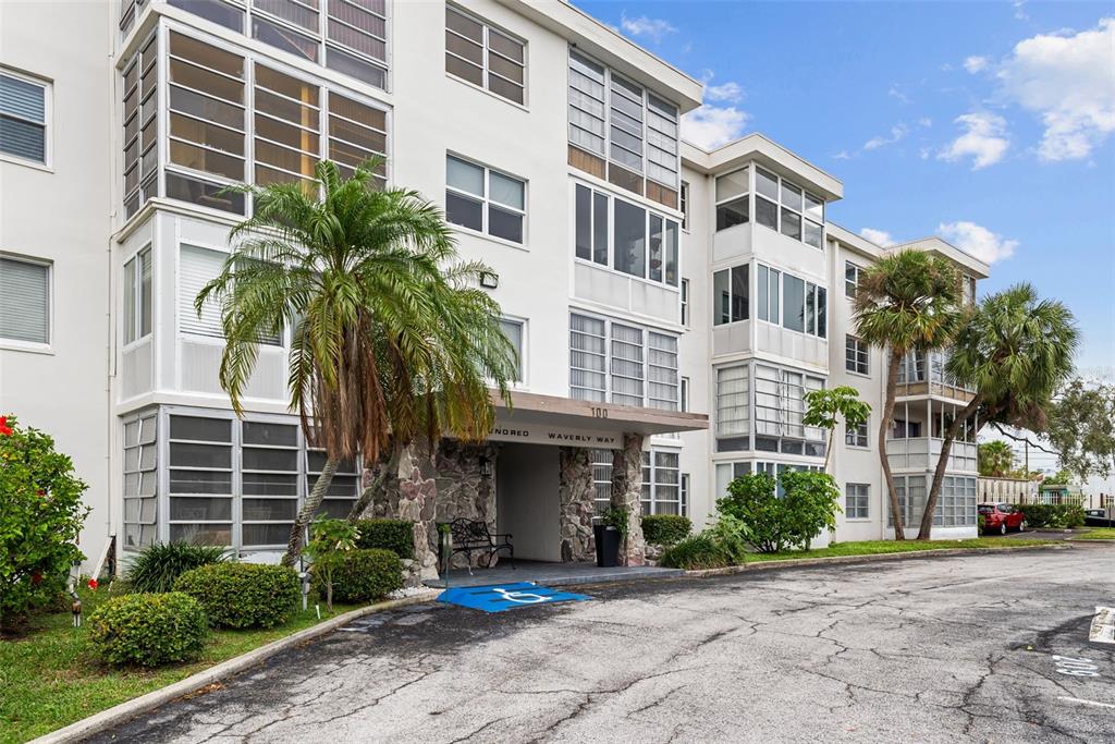 100 Waverly Way, Unit 403 Clearwater, FL 33756 - Photo 1 of 49 a front view of a multi story building with a yard