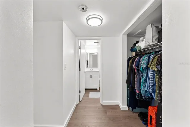 a view of a hallway with walk in closet
