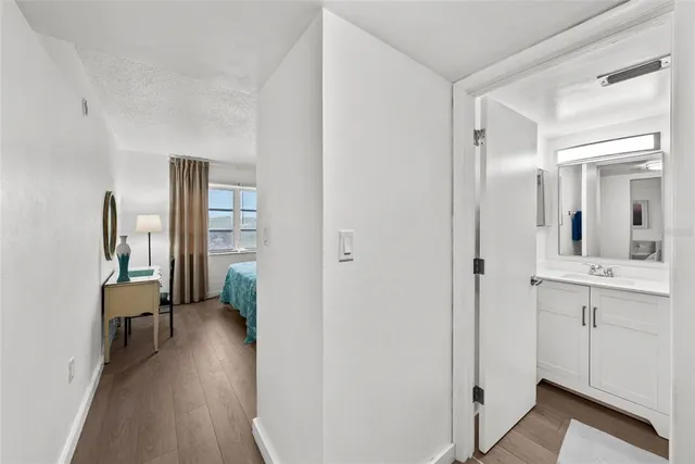 a bathroom with a sink and mirror