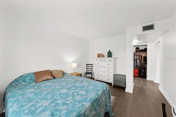 a bedroom with a bed and furniture