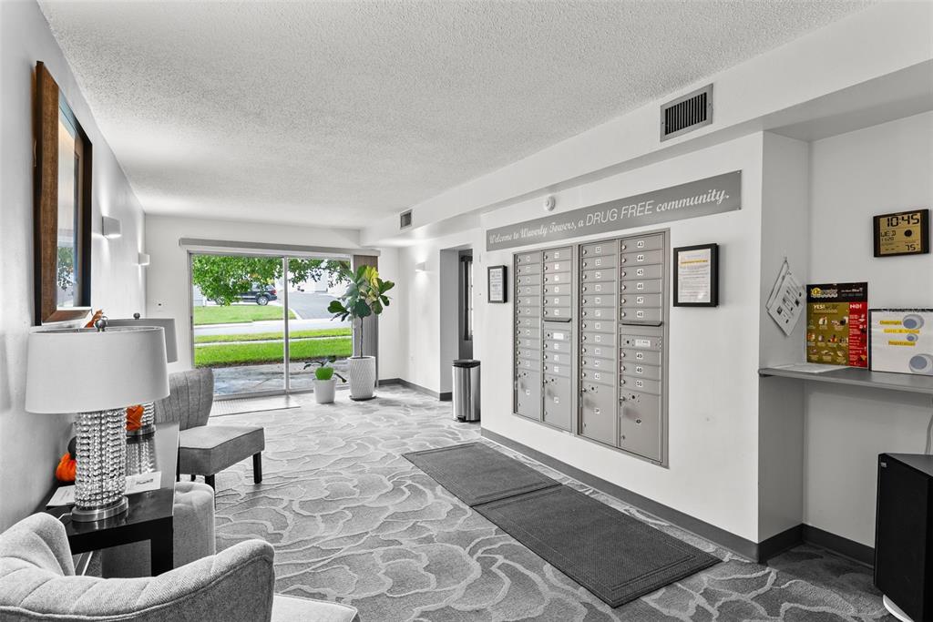 100 Waverly Way, Unit 403 Clearwater, FL 33756 - Photo 29 of 49 a living room with furniture and a garden