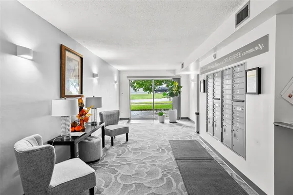 a living room filled with furniture and a large window