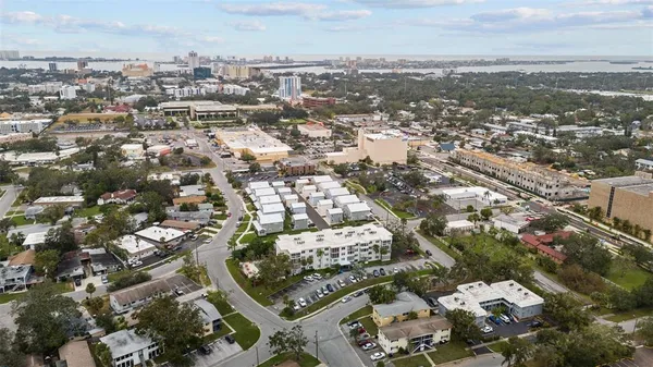 an aerial view of residential building with parking
