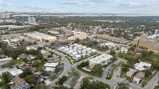 an aerial view of residential building with parking