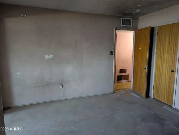 a view of an empty room with a window