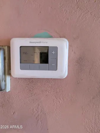 a utility room with a stove and a microwave