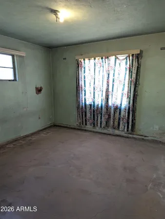an empty room with windows