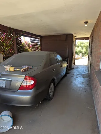 a view of a car park in front of a house