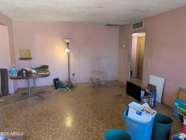 a room with furniture and a lamp